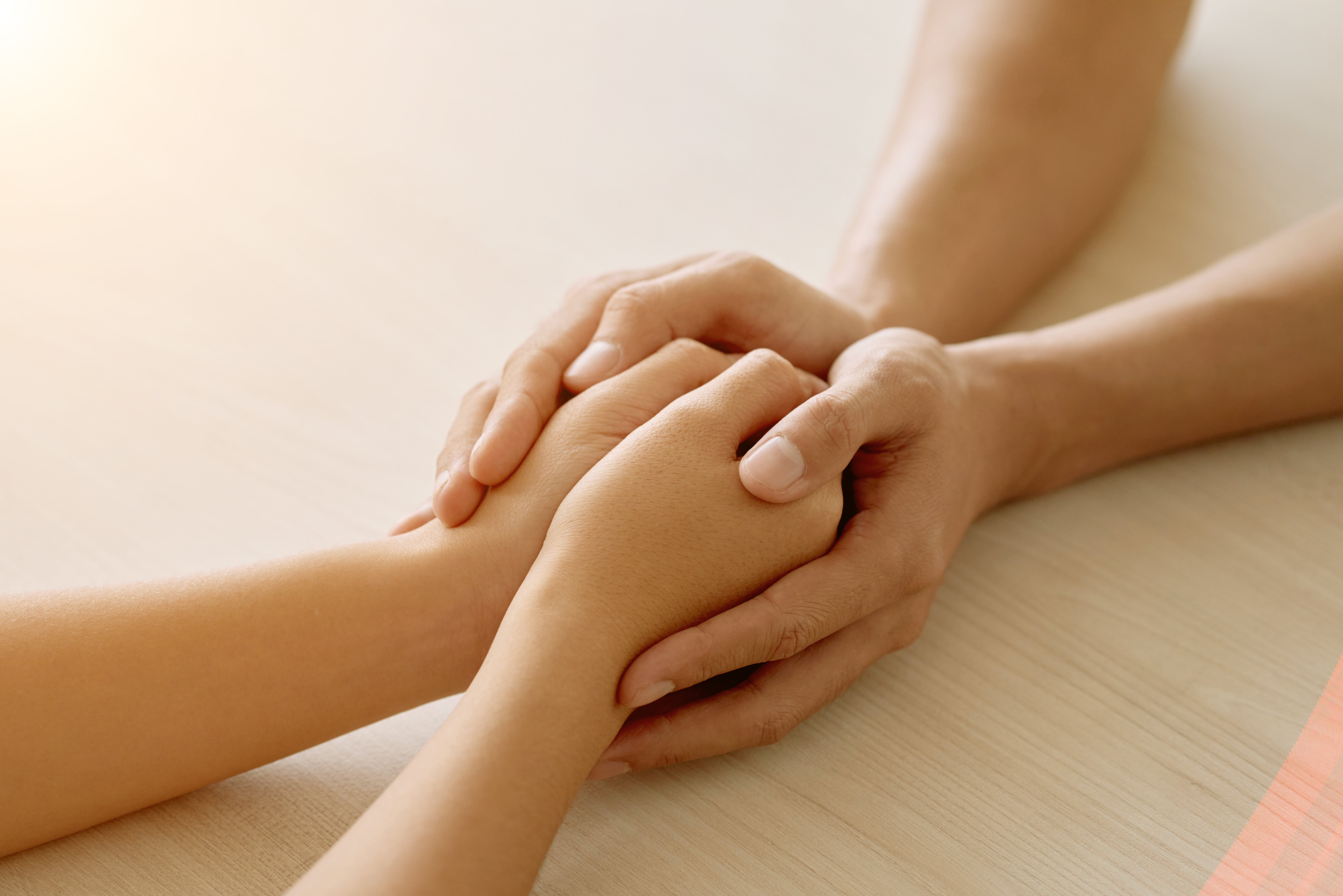 hands-anonymous-supportive-friend-holding-hands-woman.jpg