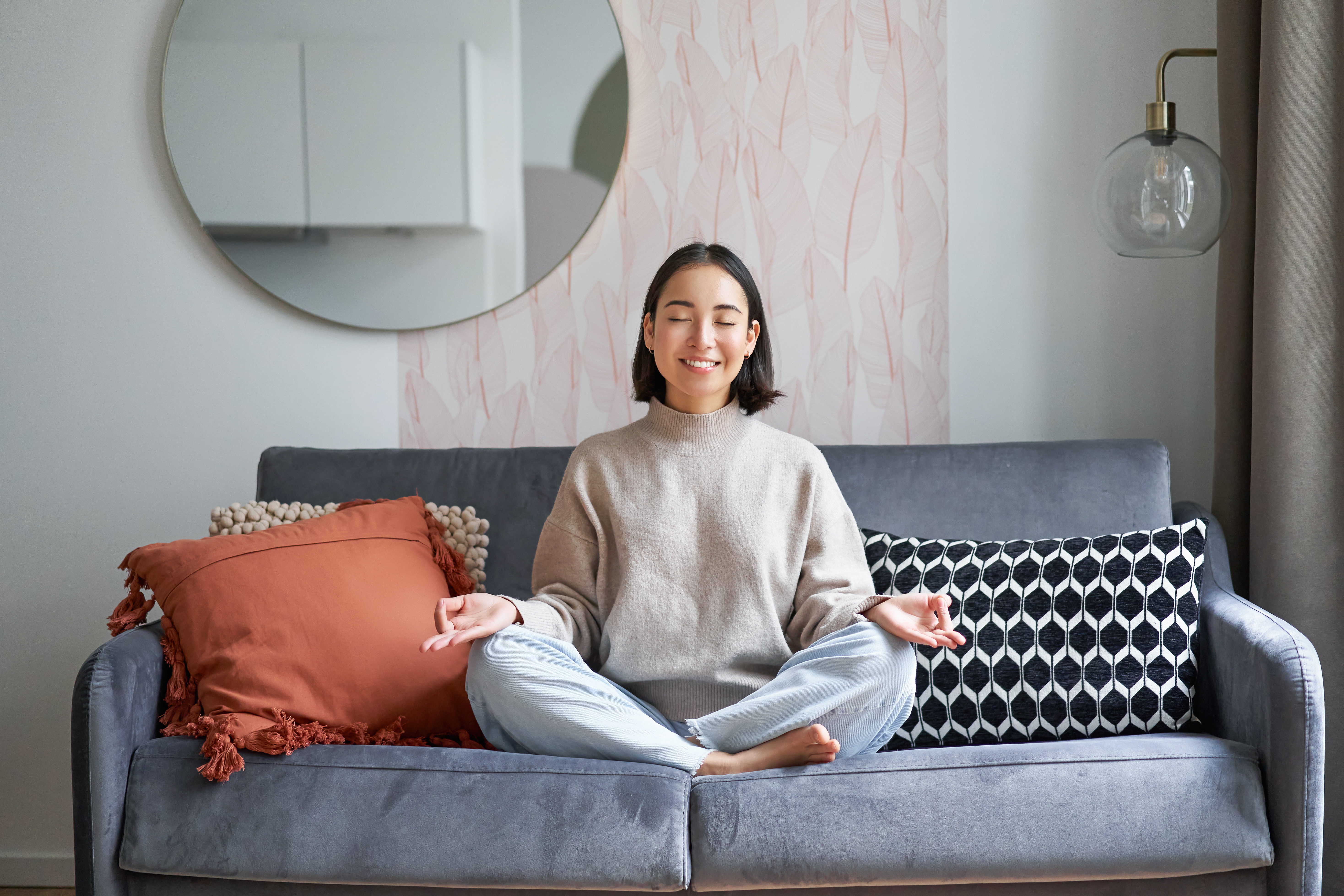 relaxation-patience-smiling-young-asian-woman-cozy-room-sitting-sofa-meditating-doing.jpg